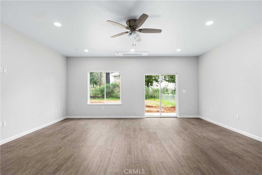 5583 Linrich Lane Paradise, CA 95969 - Photo 9 of 33 wooden floor in an empty room with a window