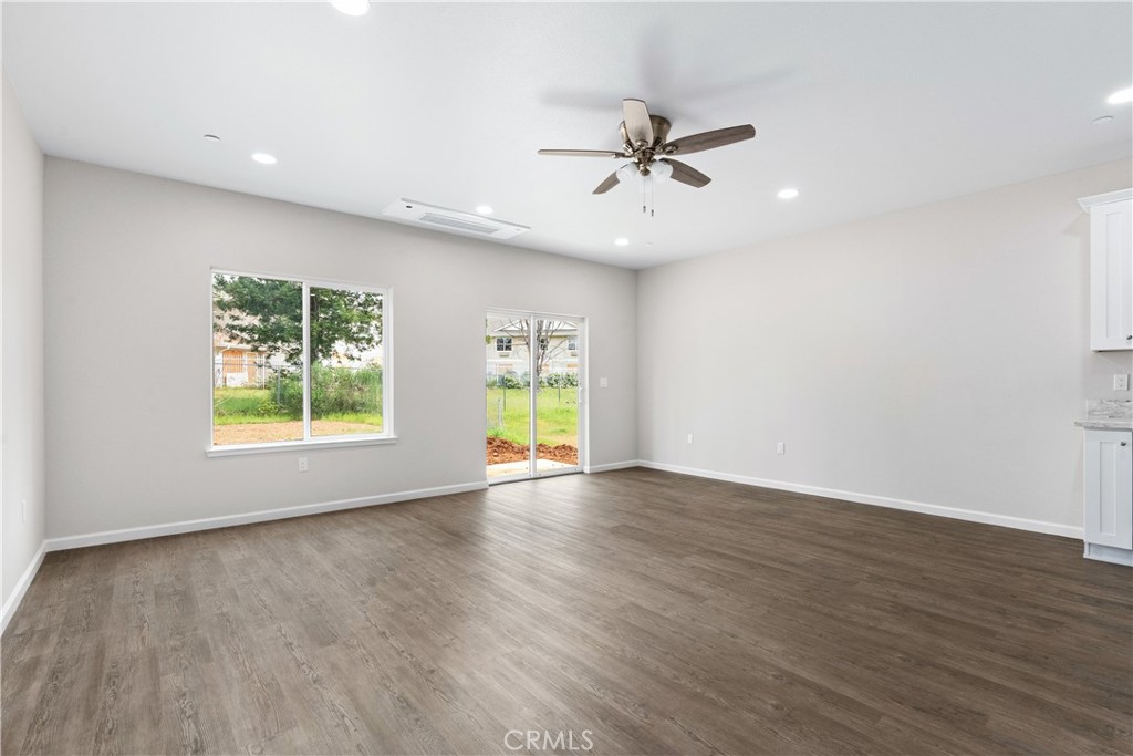 5583 Linrich Lane Paradise, CA 95969 - Photo 10 of 33 a view of an empty room with wooden floor and window