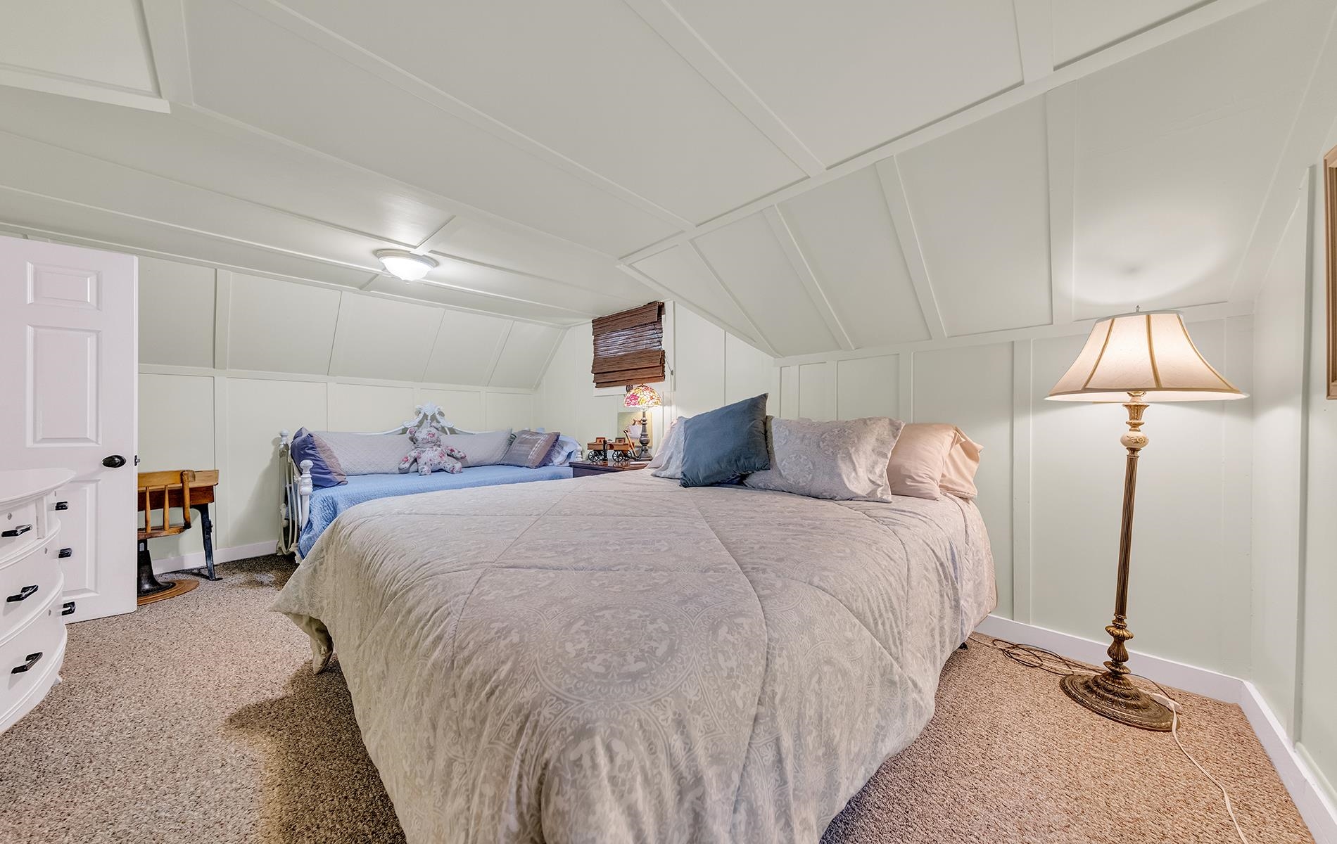 167 Stover Road Chester, CA 96020 - Photo 23 of 33 a bed room with a bed and a lamp