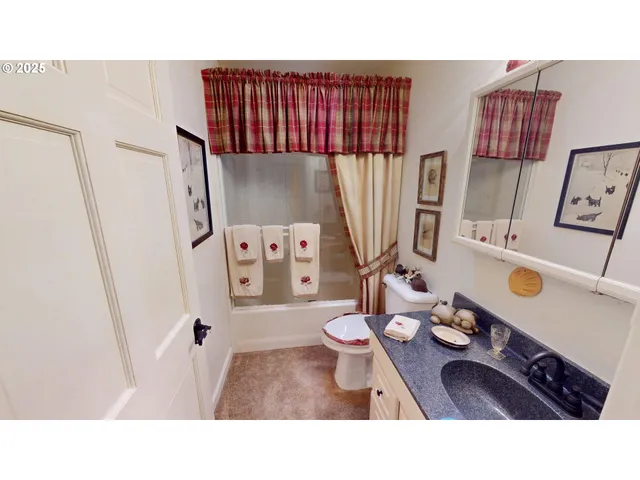 a kitchen with a table and appliances