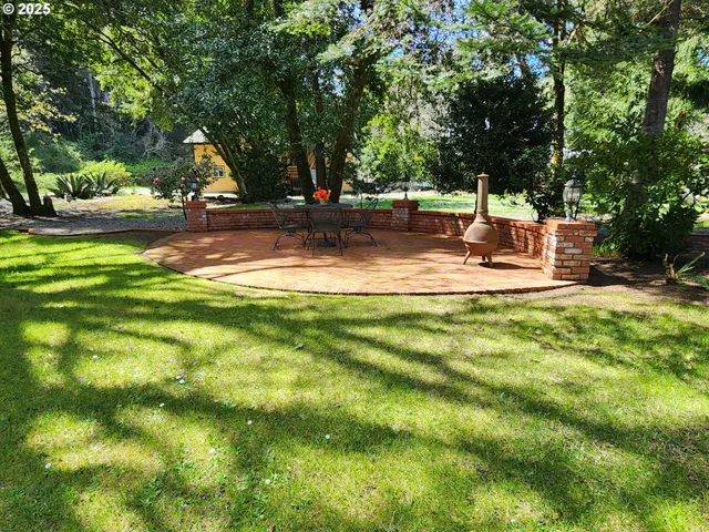 a view of a yard with swimming pool