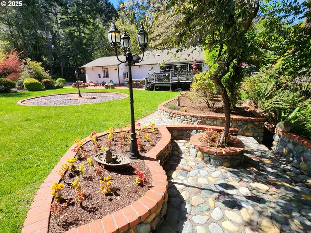 a view of a backyard with sitting area