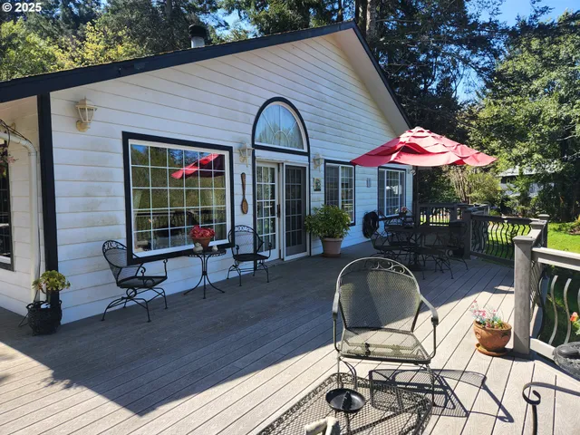 a view of a dinning table and chairs in patio of the house