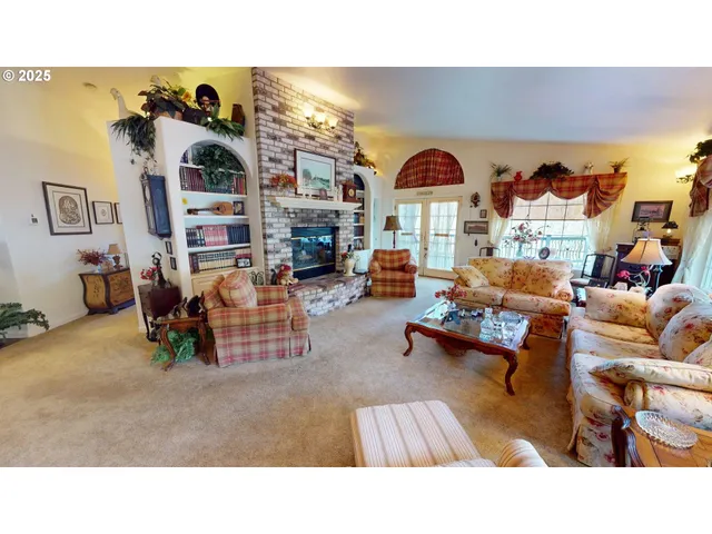 a living room with furniture and a floor to ceiling window