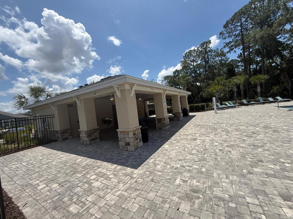 754 Chinoy Road Davenport, FL 33837 - Photo 26 of 26 a front view of house with yard outdoor seating and barbeque oven