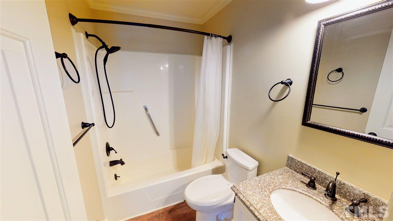 6100 Highcastle Court Raleigh, NC 27613 - Photo 17 of 23 Master Bath with tub/shower