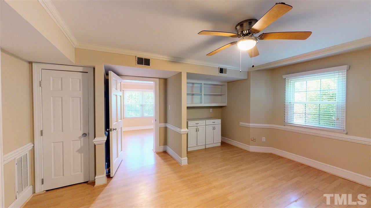 6100 Highcastle Court Raleigh, NC 27613 - Photo 21 of 23 Shelving and windows would make for a great office.