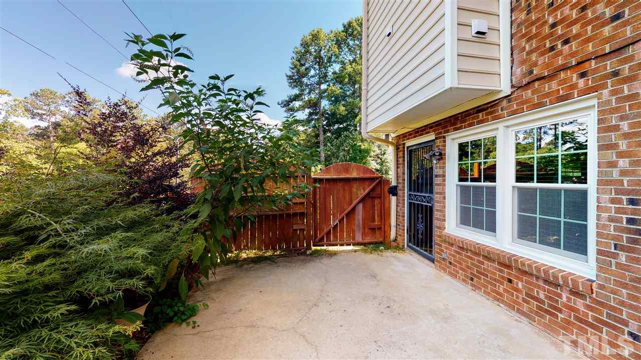6100 Highcastle Court Raleigh, NC 27613 - Photo 22 of 23 Fenced in courtyard so lovely even COVID will seem far away.
