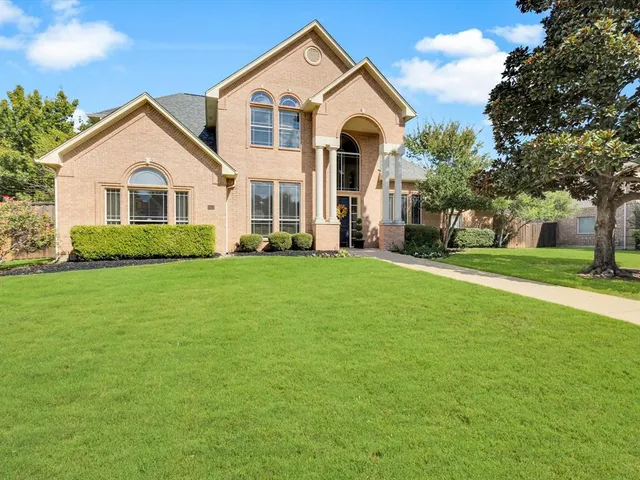 a view of house with yard and green space