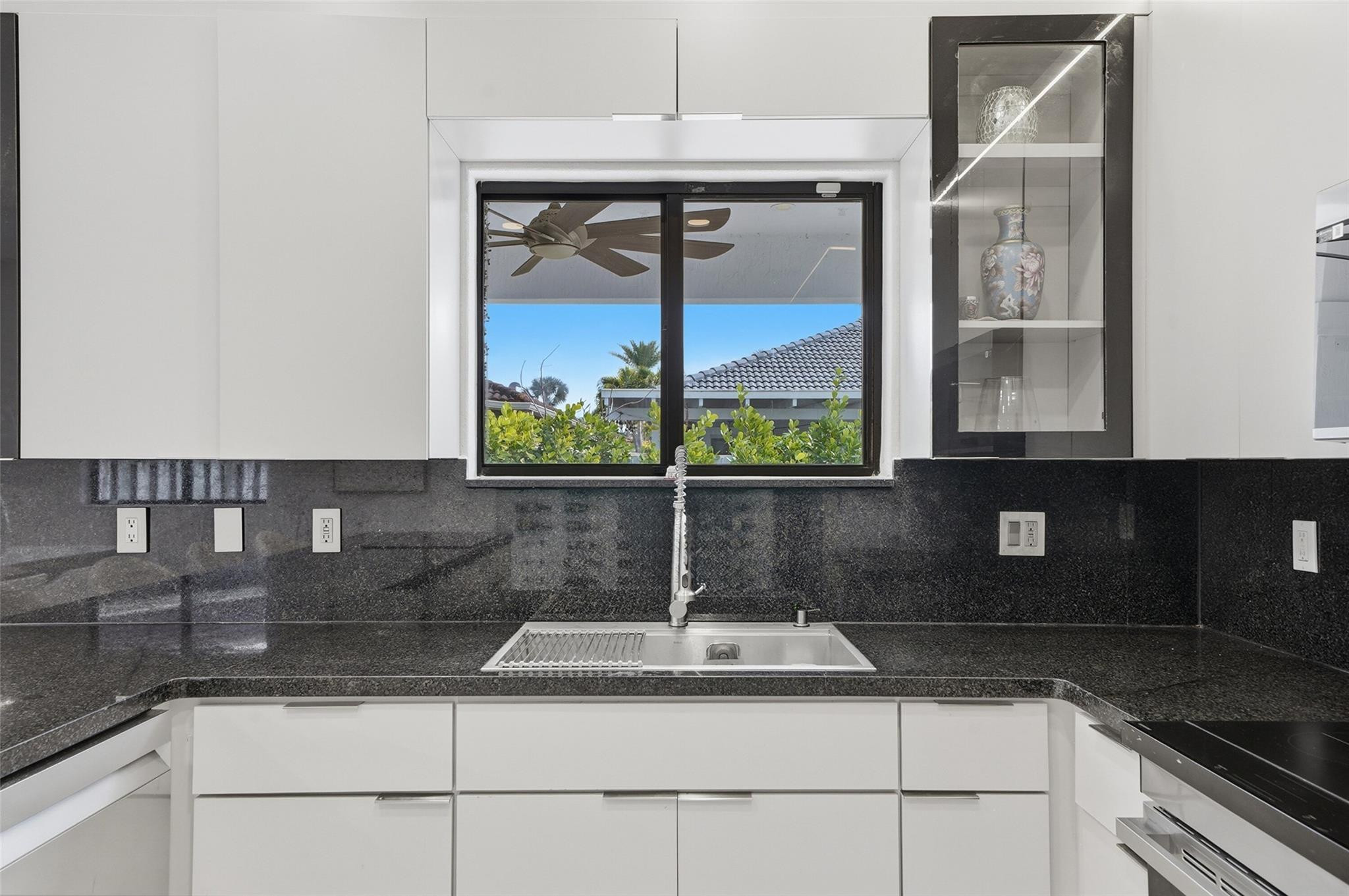 4429 Southwest 165th Court Miami, FL 33185 - Photo 18 of 58 a kitchen with a sink and a window