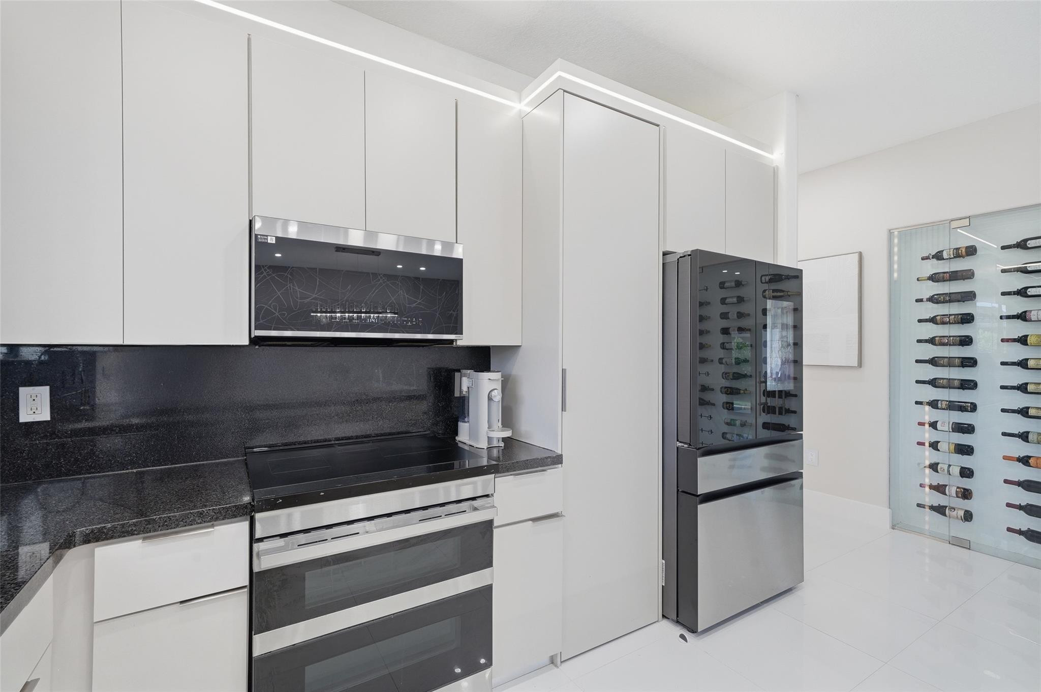4429 Southwest 165th Court Miami, FL 33185 - Photo 20 of 58 a kitchen with appliances and cabinets