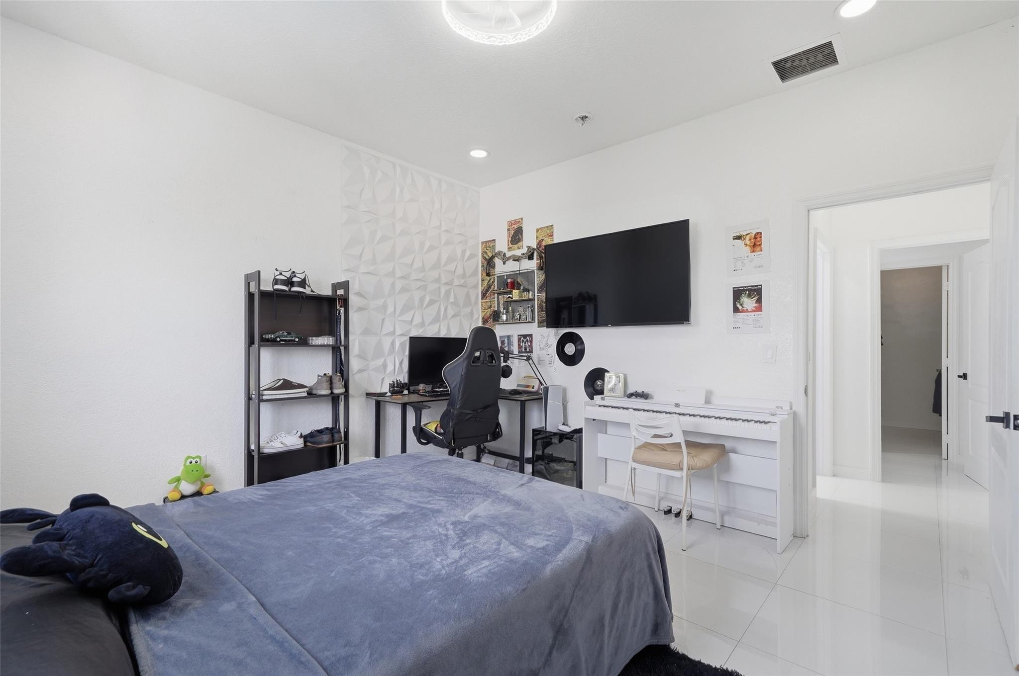 4429 Southwest 165th Court Miami, FL 33185 - Photo 30 of 58 a bedroom with a bed and a flat screen tv