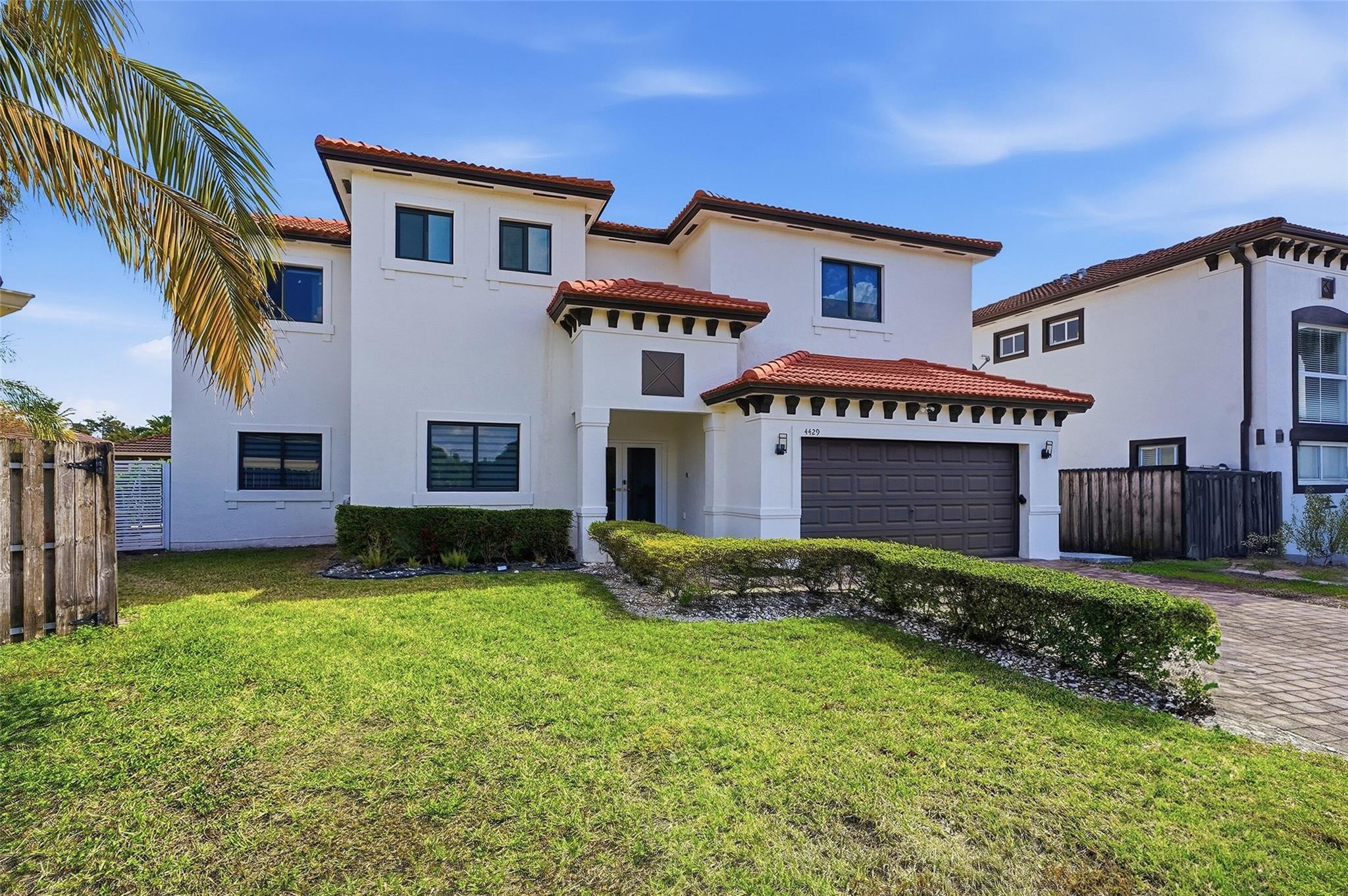 4429 Southwest 165th Court Miami, FL 33185 - Photo 3 of 58 a front view of a house with a yard