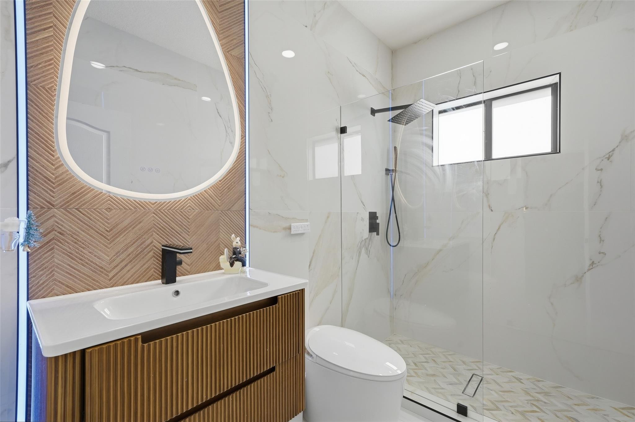 4429 Southwest 165th Court Miami, FL 33185 - Photo 31 of 58 a bathroom with a sink a toilet and shower