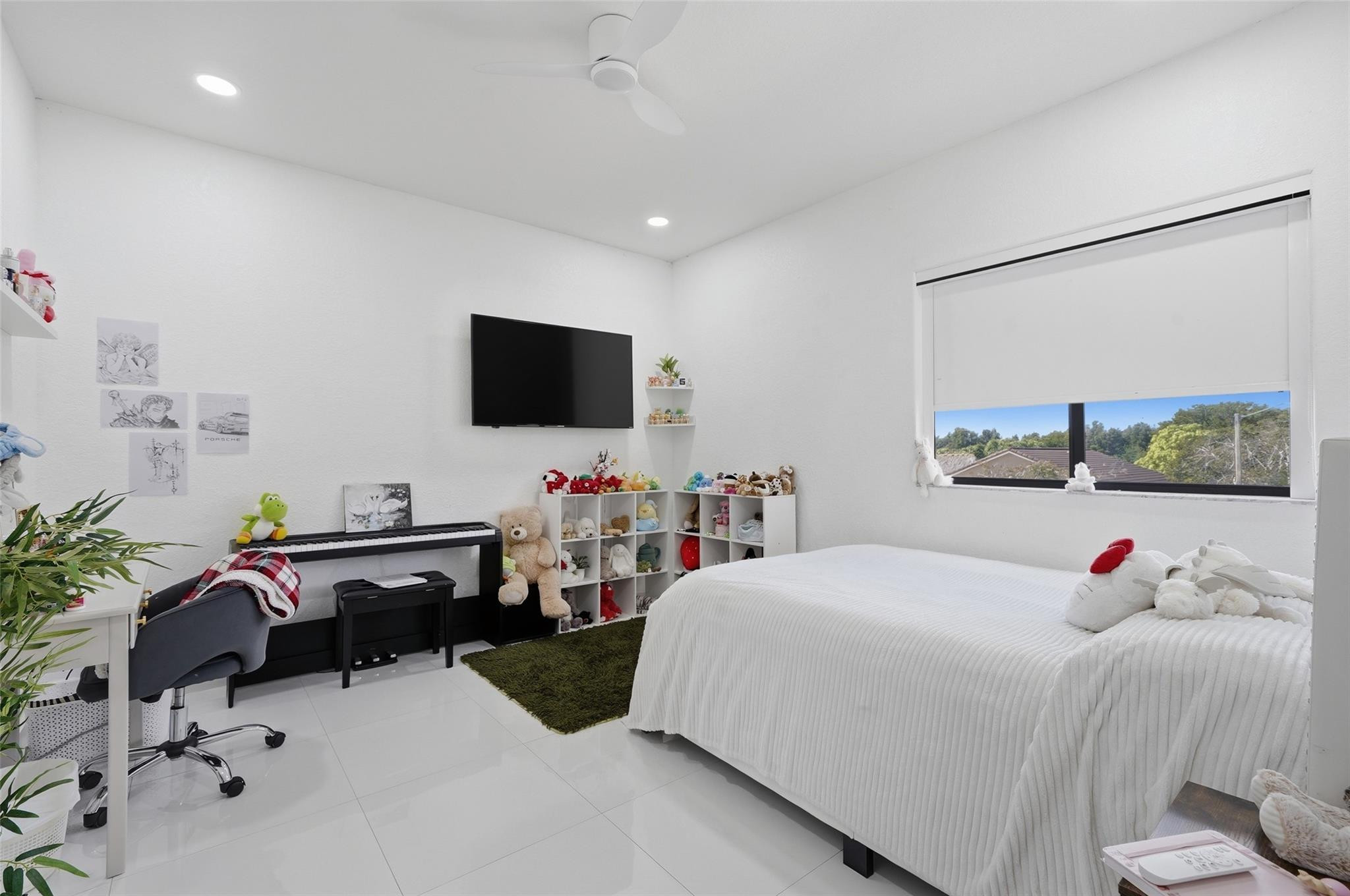 4429 Southwest 165th Court Miami, FL 33185 - Photo 33 of 58 a bedroom with a bed and flat screen tv