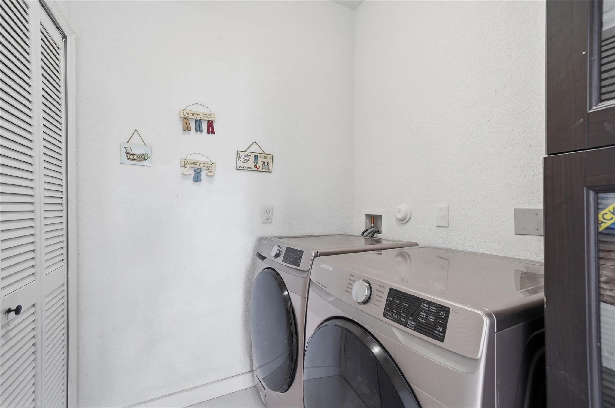 4429 Southwest 165th Court Miami, FL 33185 - Photo 36 of 58 a utility room with dryer and washer