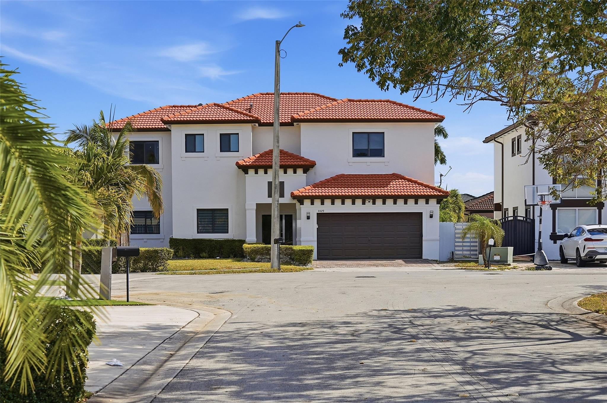 4429 Southwest 165th Court Miami, FL 33185 - Photo 4 of 58 a front view of a building with a garden
