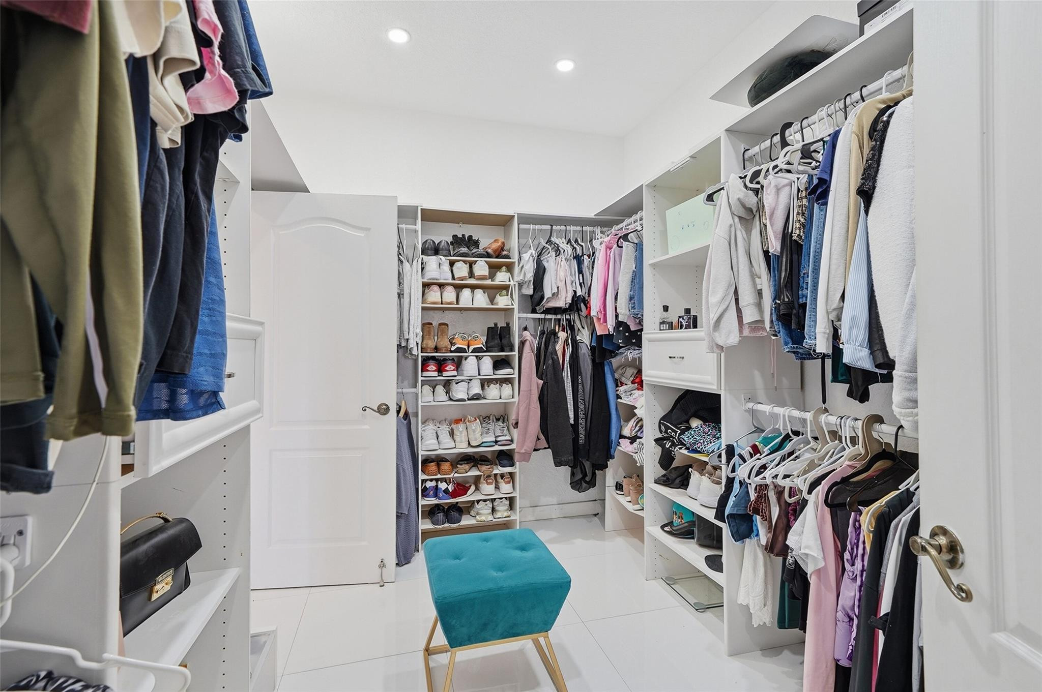 4429 Southwest 165th Court Miami, FL 33185 - Photo 43 of 58 a view of walk in closet with clothes
