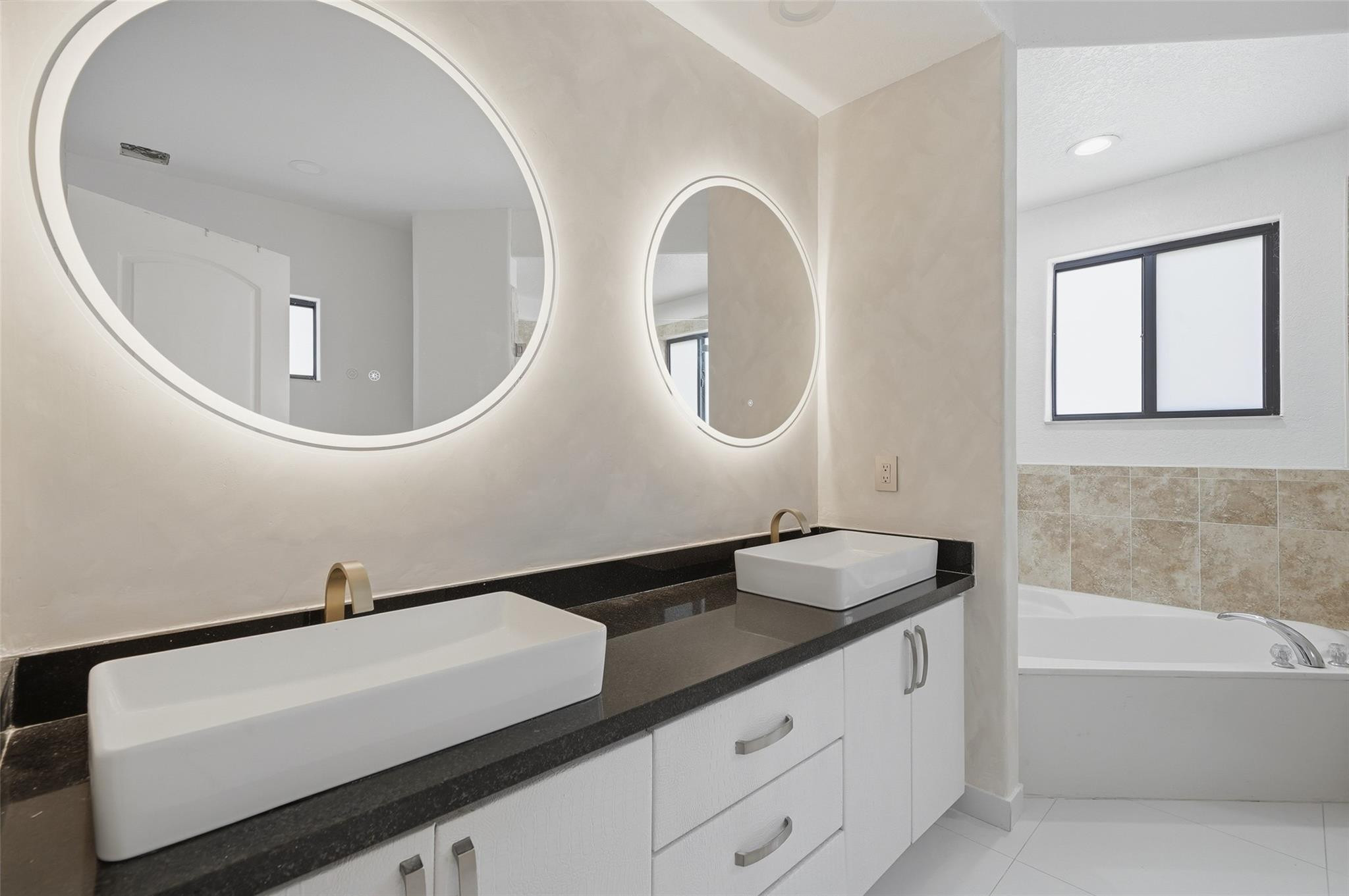 4429 Southwest 165th Court Miami, FL 33185 - Photo 44 of 58 a bathroom with a sink and a mirror