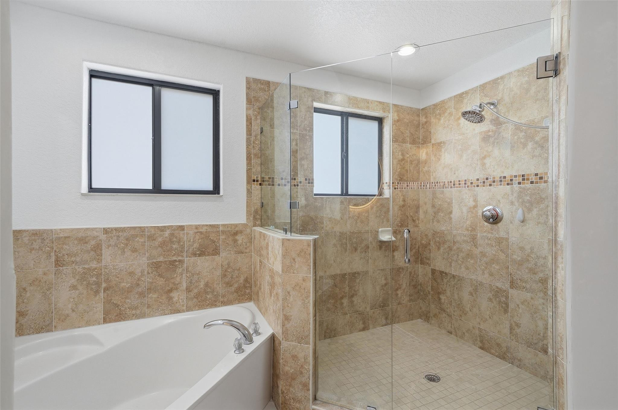 4429 Southwest 165th Court Miami, FL 33185 - Photo 47 of 58 a bathroom with a bathtub and shower