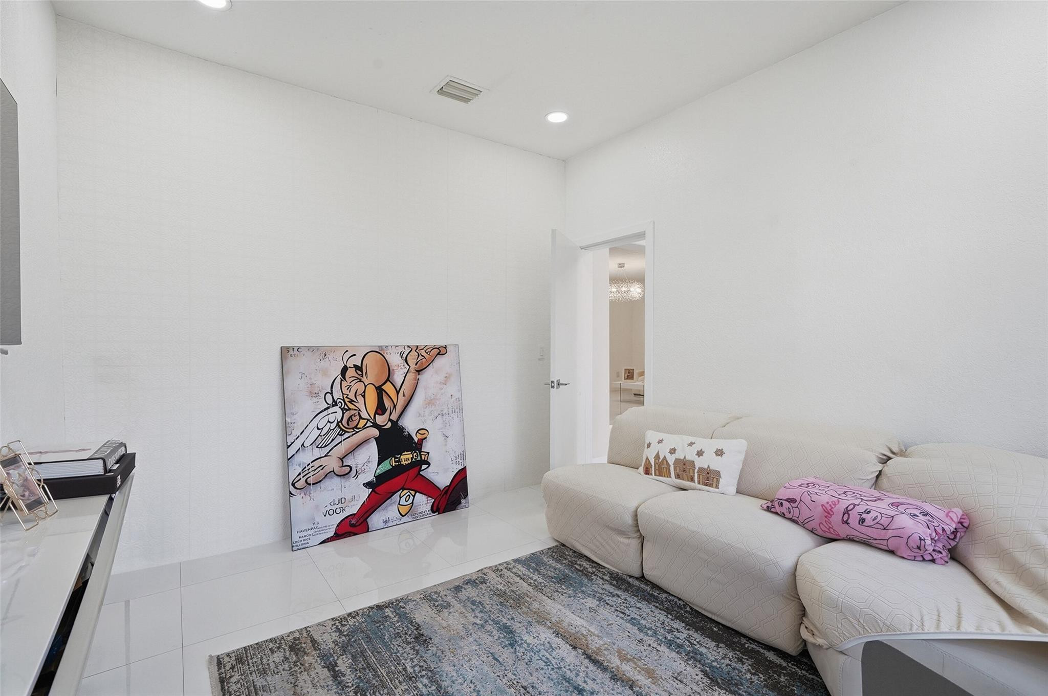 4429 Southwest 165th Court Miami, FL 33185 - Photo 10 of 58 a living room with furniture and wall painting