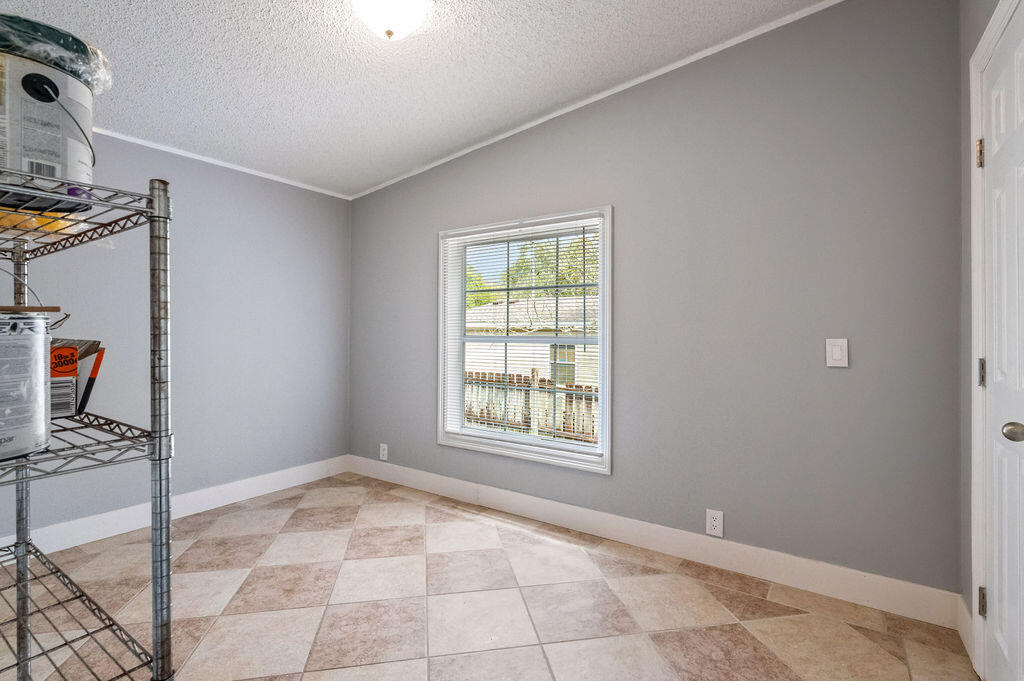 191 Beech Street Freeport, FL 32439 - Photo 15 of 18 a view of an empty room with a window