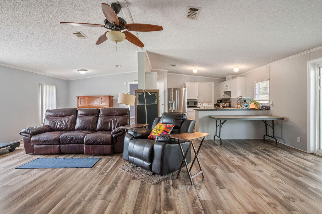 191 Beech Street Freeport, FL 32439 - Photo 5 of 18 a living room with furniture and kitchen view