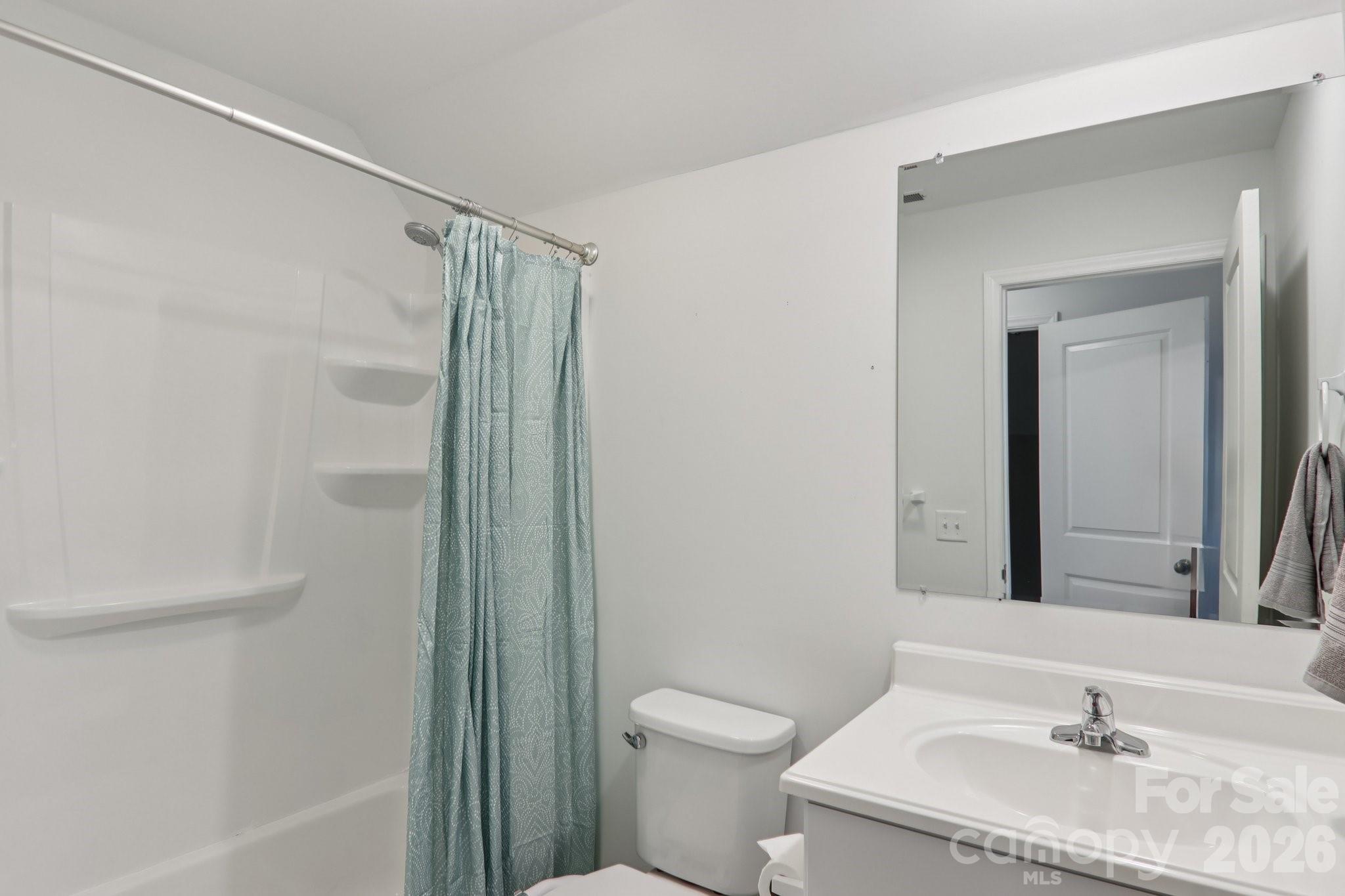 751 Hutch Mountain Road Fletcher, NC 28732 - Photo 31 of 48 a bathroom with a granite countertop sink toilet and shower