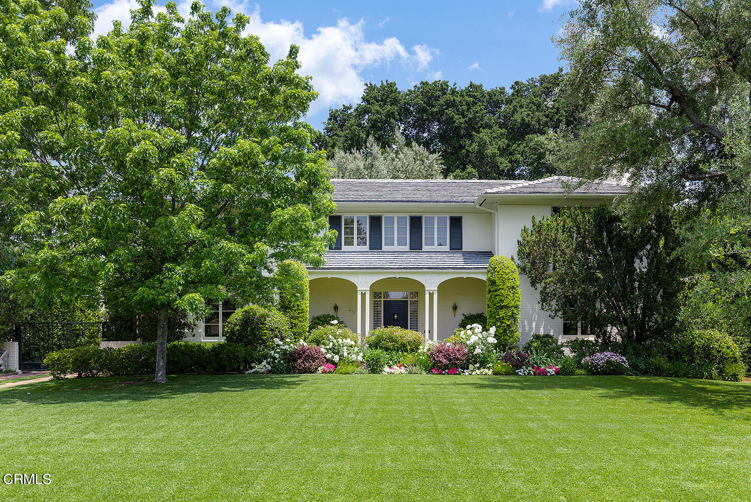 658 Chaucer Road San Marino, CA 91108 - Photo 2 of 39 a front view of a house with a garden