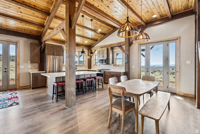 46997 West Thunder Road Fruitland, UT 84027 - Photo 9 of 49 Dining room featuring plenty of natural light, wooden ceiling, light wood finished floors, french doors, and recessed lighting