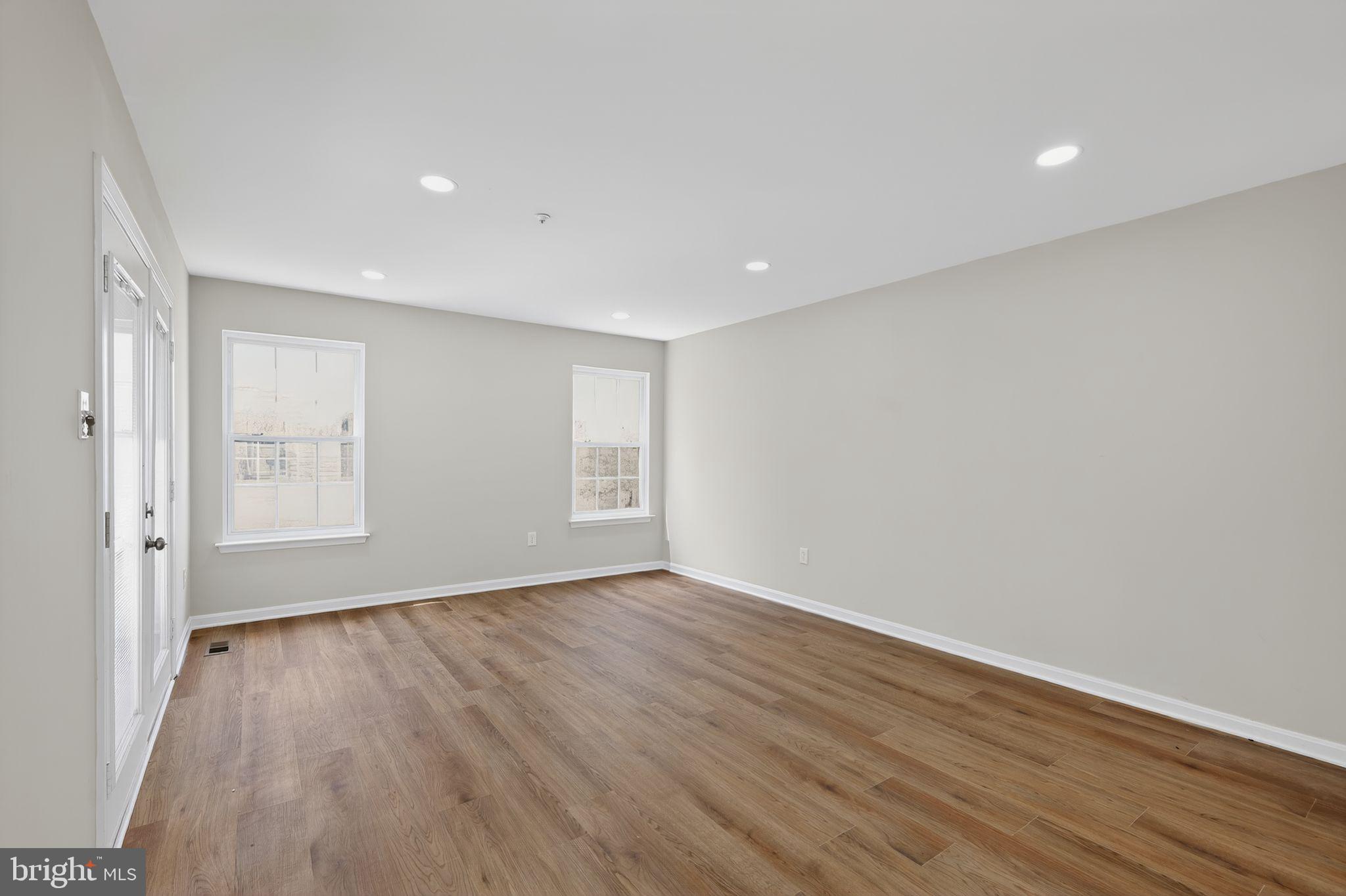 3003 Hillside Avenue Landover, MD 20785 - Photo 12 of 38 a view of an empty room with wooden floor and a window