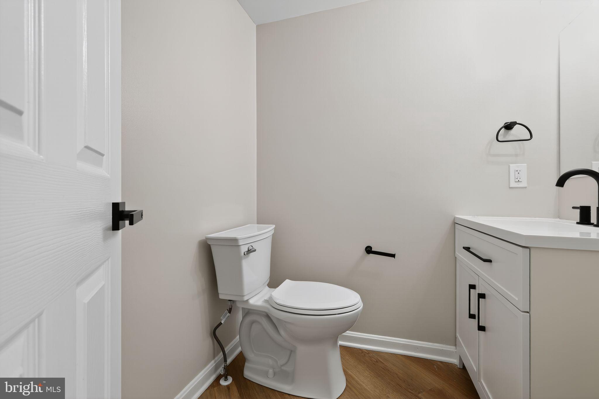 3003 Hillside Avenue Landover, MD 20785 - Photo 16 of 38 a bathroom with a sink and a toilet