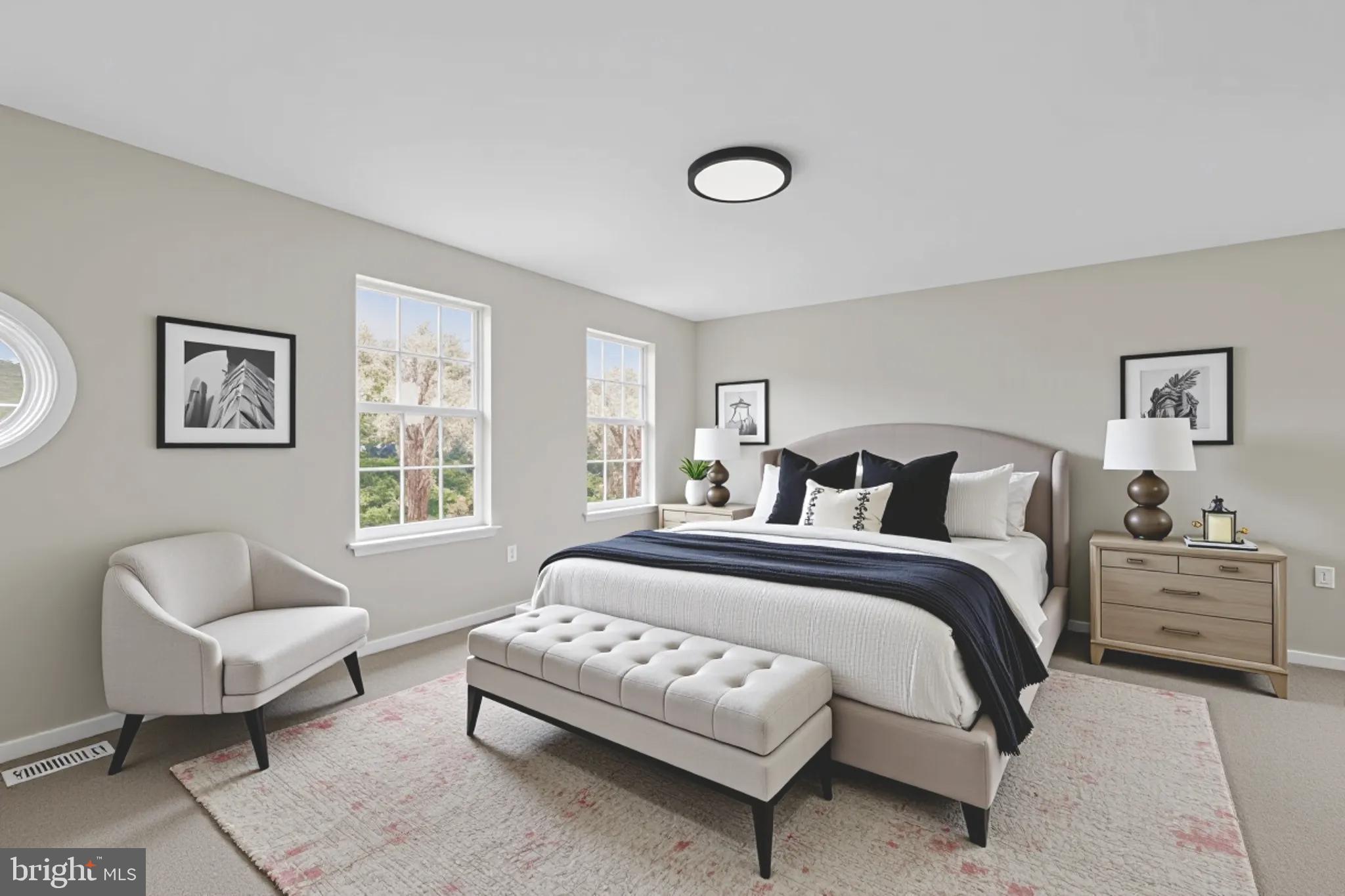 3003 Hillside Avenue Landover, MD 20785 - Photo 20 of 38 a spacious bedroom with a bed and a couch