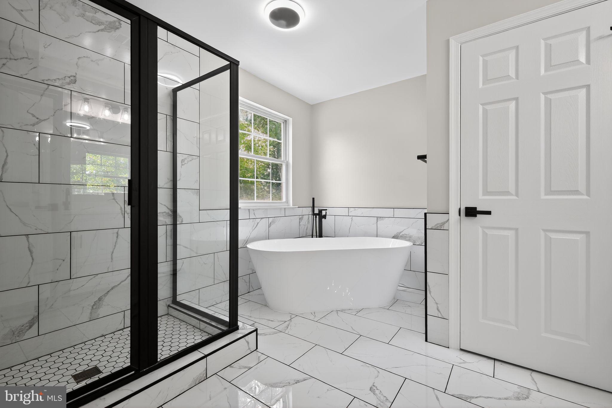 3003 Hillside Avenue Landover, MD 20785 - Photo 23 of 38 a bathroom with a bathtub and shower