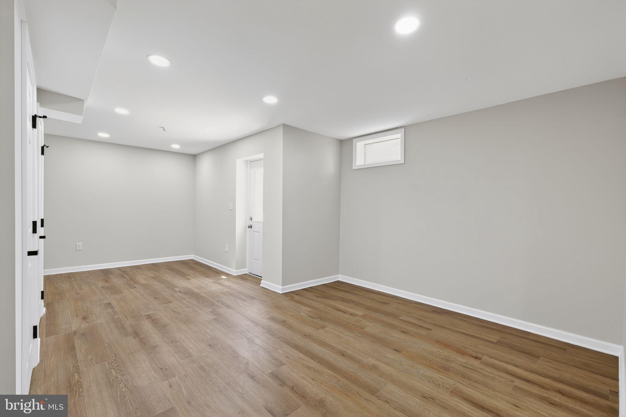 3003 Hillside Avenue Landover, MD 20785 - Photo 35 of 38 a view of an empty room with wooden floor
