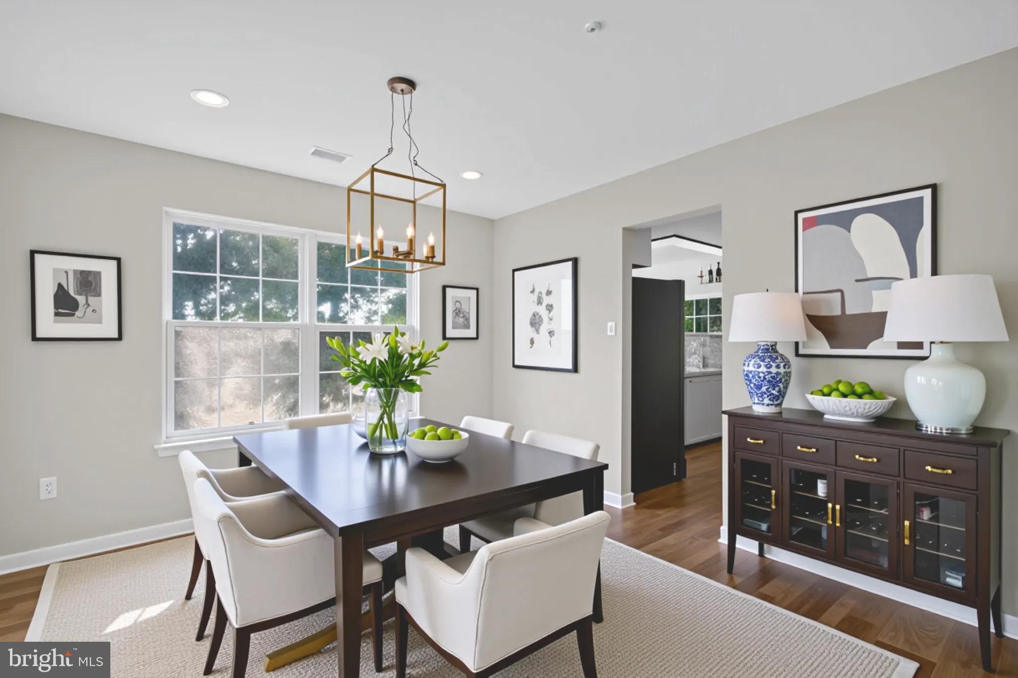 3003 Hillside Avenue Landover, MD 20785 - Photo 8 of 38 a dining room with furniture a chandelier and window