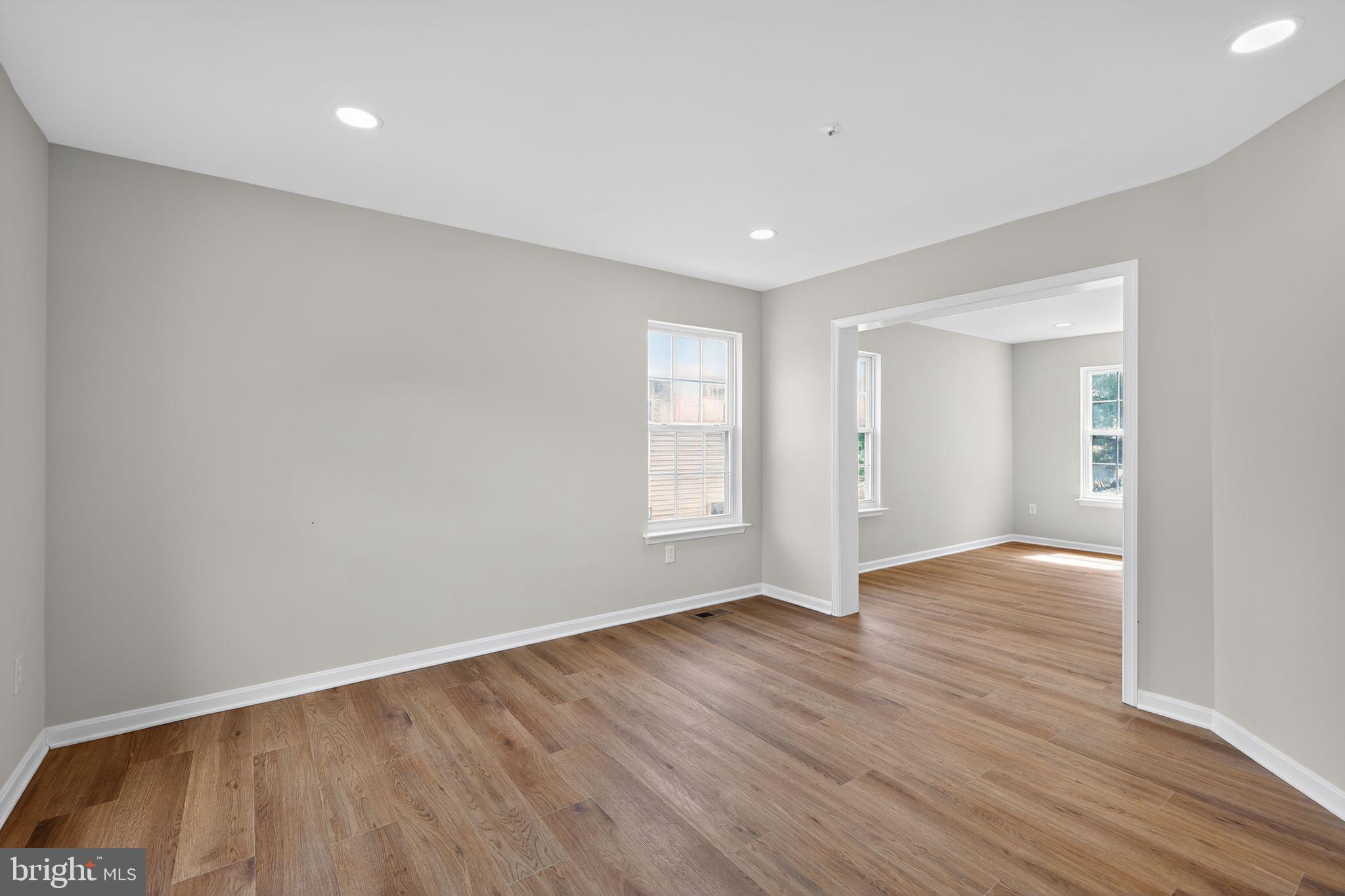 3003 Hillside Avenue Landover, MD 20785 - Photo 10 of 38 a view of an empty room with wooden floor and a window