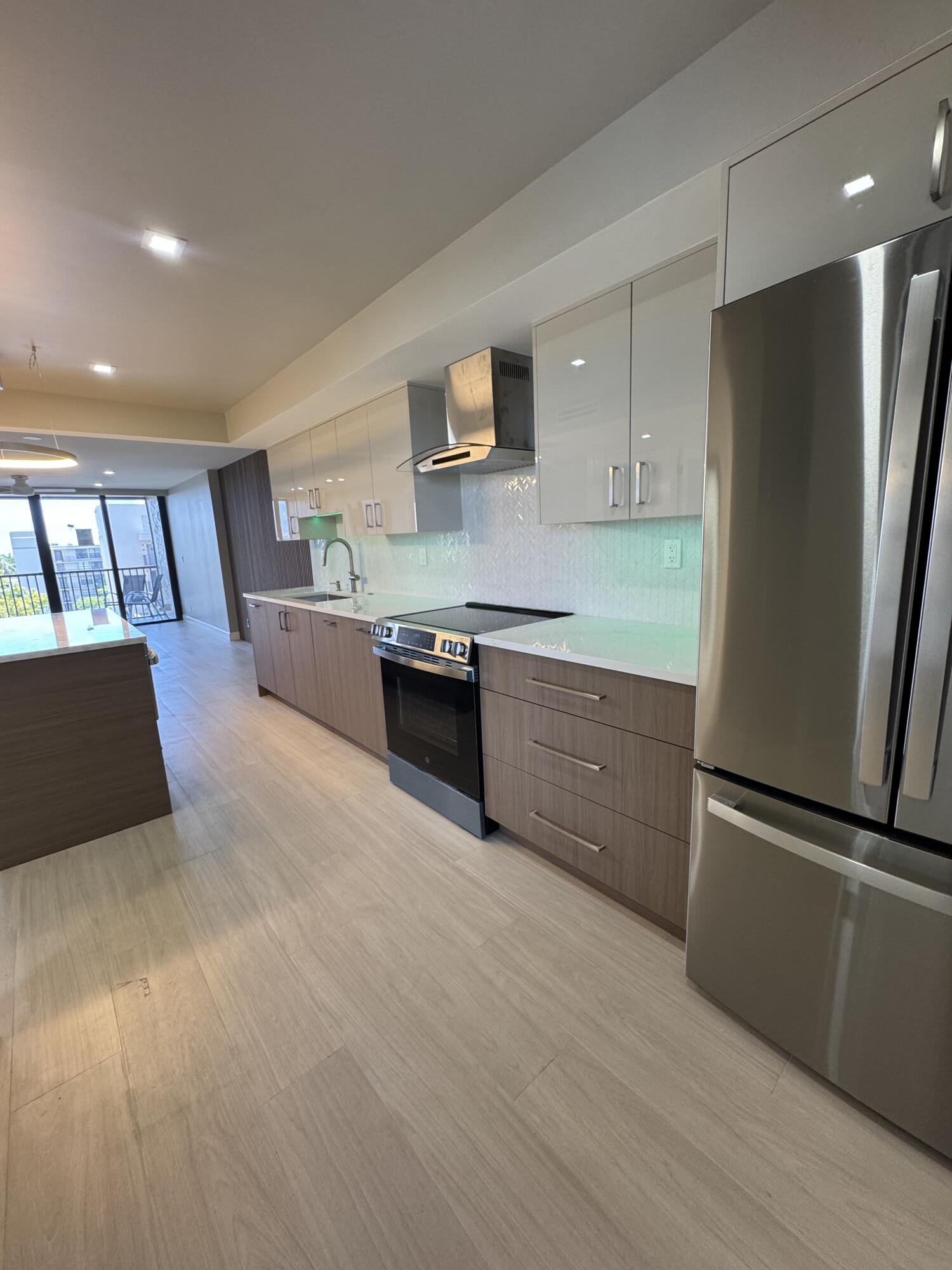 12 Royal Palm Way, Unit 6030 Boca Raton, FL 33432 - Photo 1 of 20 a kitchen with stainless steel appliances granite countertop a refrigerator a stove and a sink