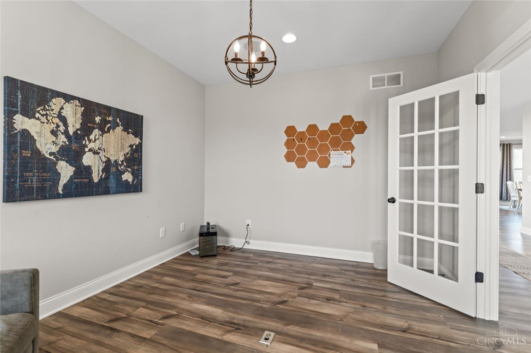 2425 Middleboro Road Clarksville, OH 45113 - Photo 28 of 91 This versatile room features warm flooring and ample natural light, ideal for a home office or study.