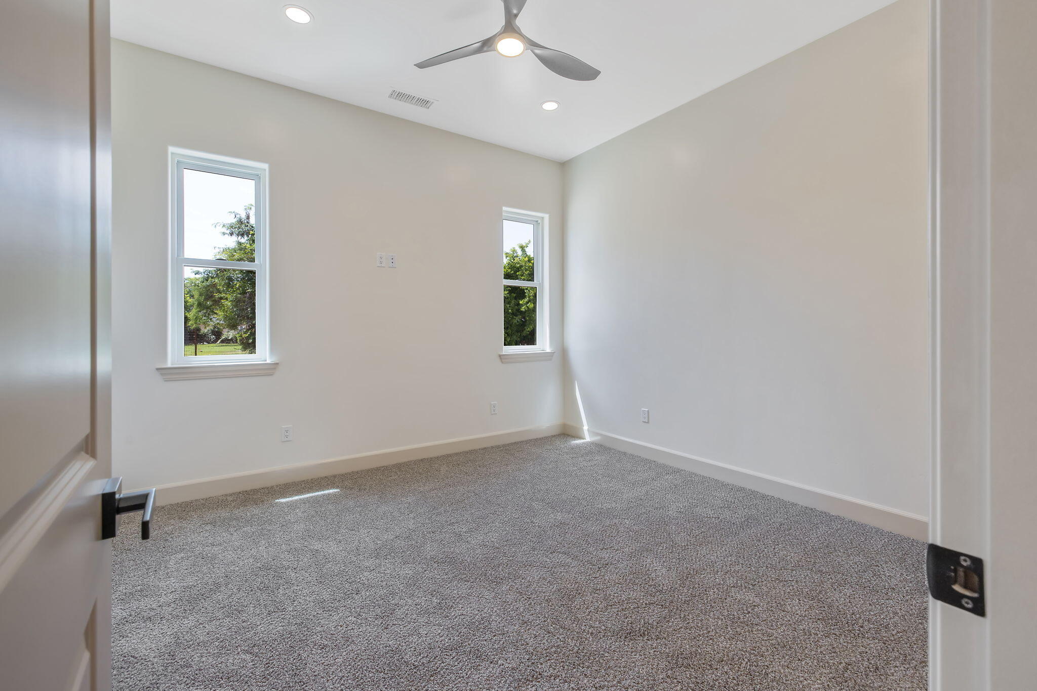 503 East Palm Street Exeter, CA 93221 - Photo 44 of 92 an empty room with windows and fan