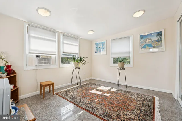 a view of a livingroom with furniture and windows