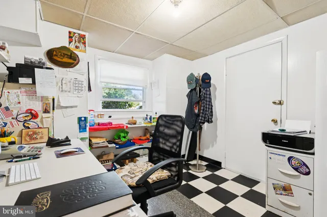 a room with furniture and musical instruments