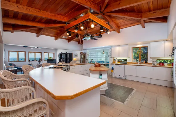 a room with lots of furniture and wooden floor