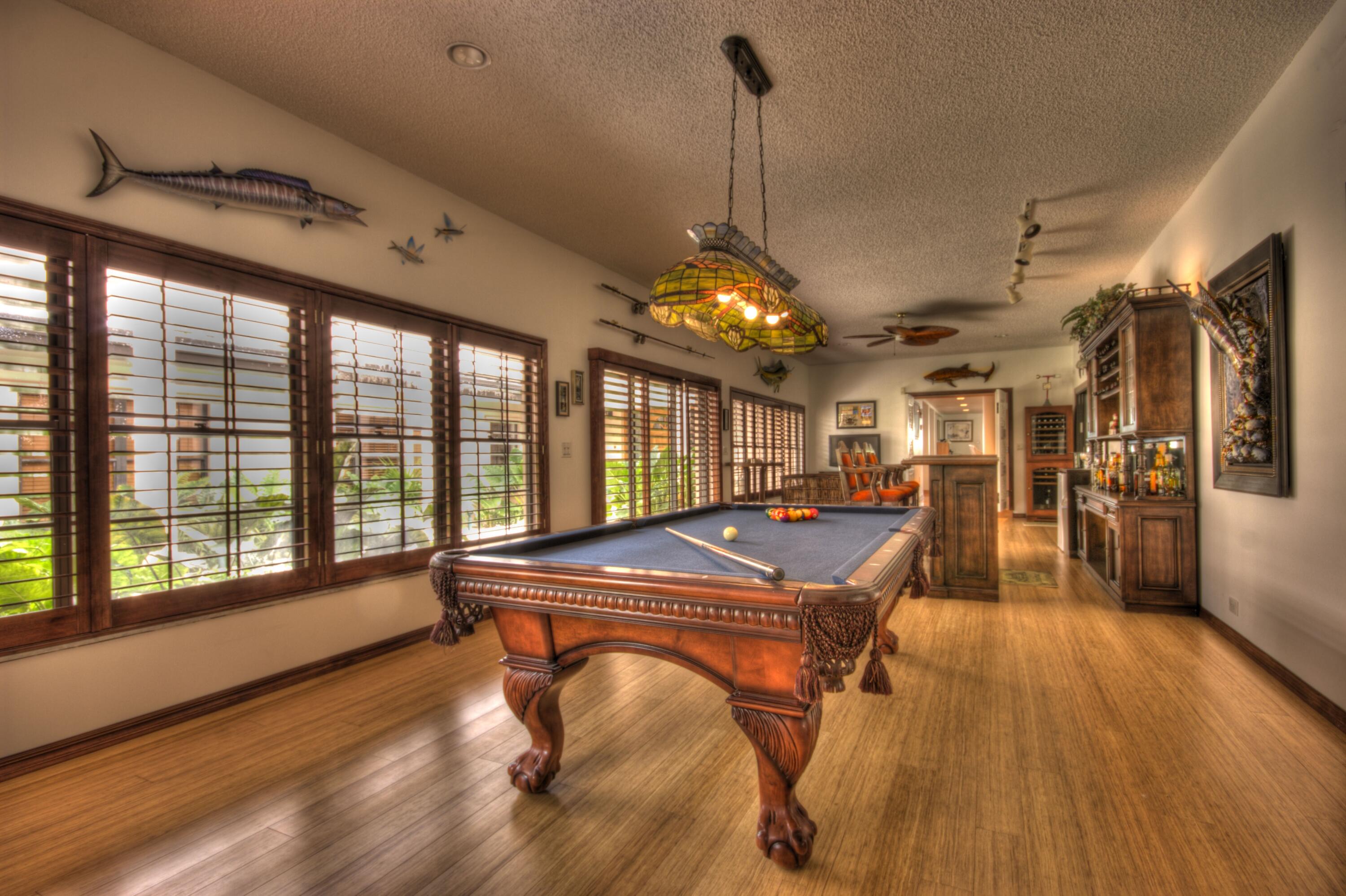 57121 Morton Street Marathon, FL 33050 - Photo 13 of 66 a room with lots of windows and wooden floor