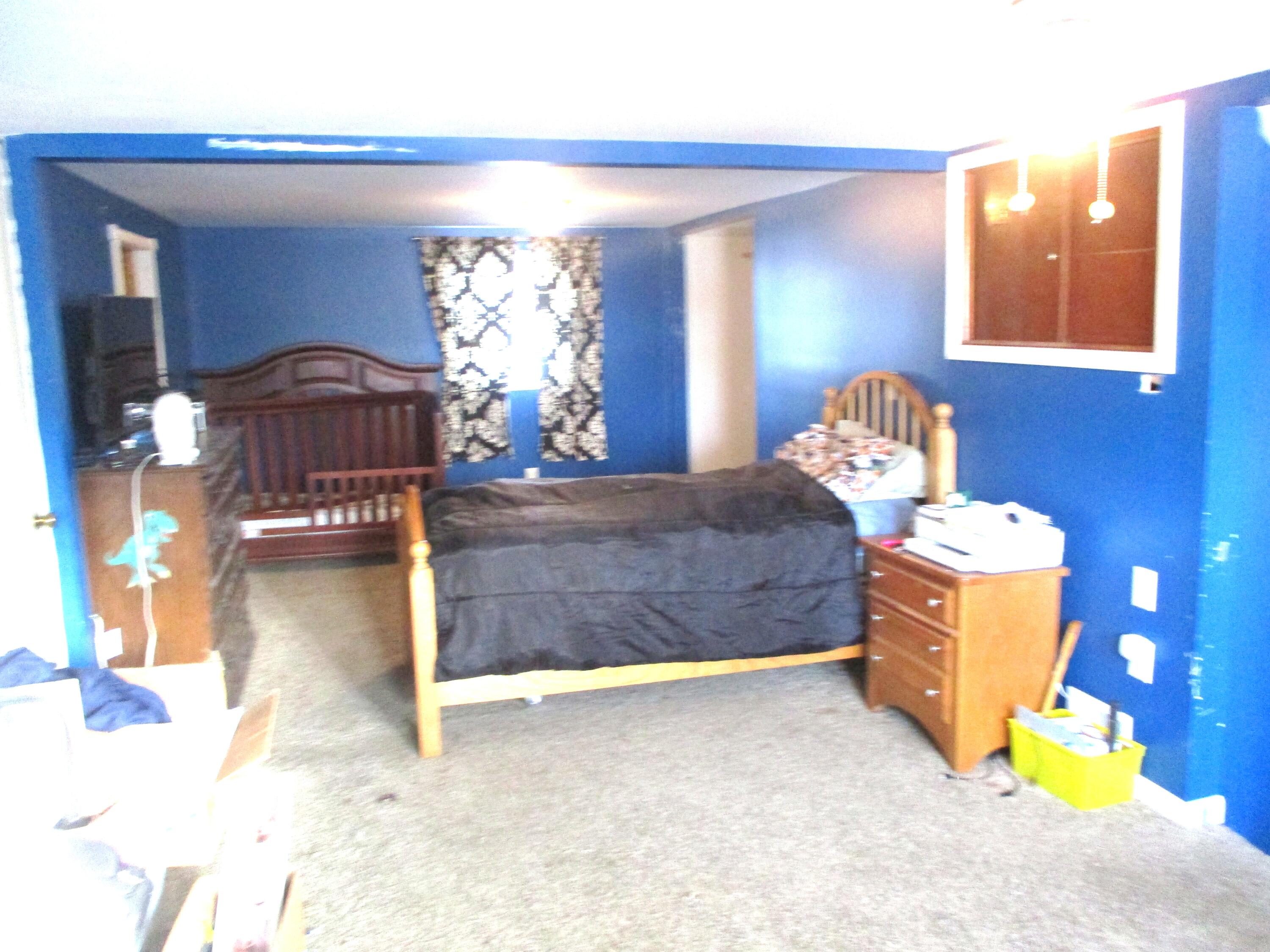 1158 South State Road Hebron, IN 46341 - Photo 7 of 19 a bedroom with a bed and window