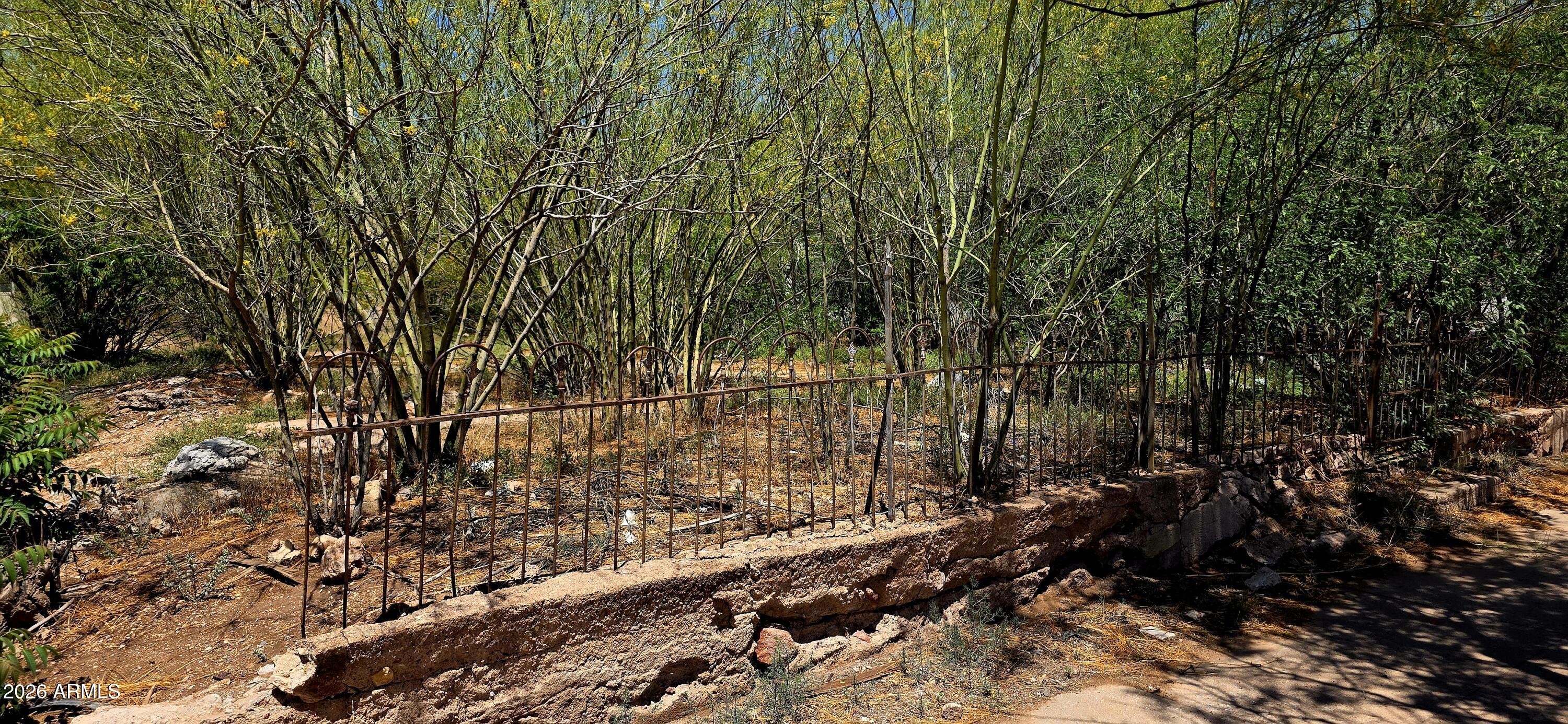 626 East 7th Street, Unit 9 Douglas, AZ 85607 - Photo 3 of 7 a view of a yard with wooden fence