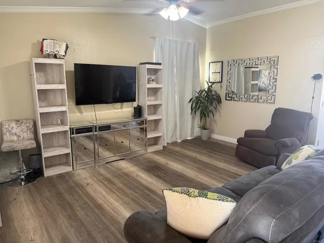 a view of a dining room with furniture and wooden floor