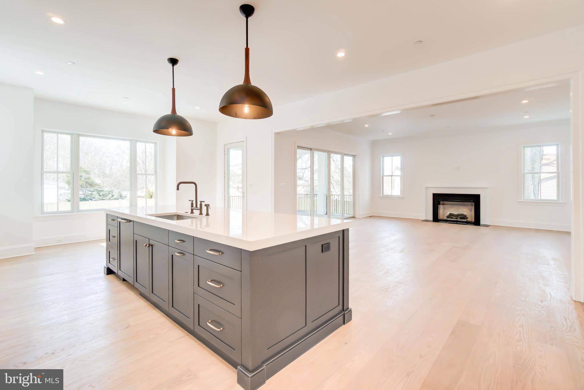 7408 Pyle Road Bethesda, MD 20817 - Photo 11 of 81 a kitchen with stainless steel appliances kitchen island a large island in the center