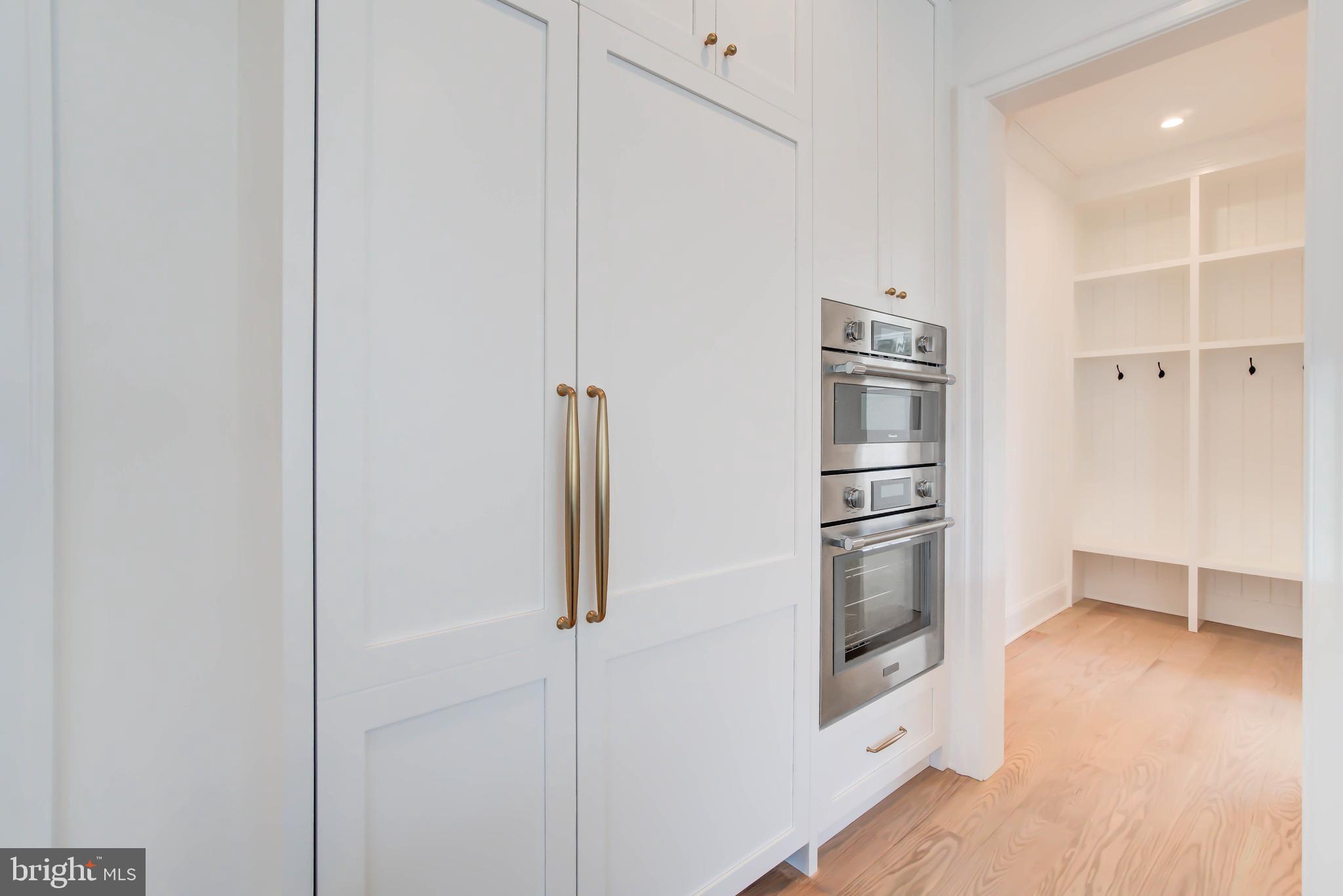 7408 Pyle Road Bethesda, MD 20817 - Photo 17 of 81 a kitchen with stainless steel appliances a refrigerator and a stove top oven