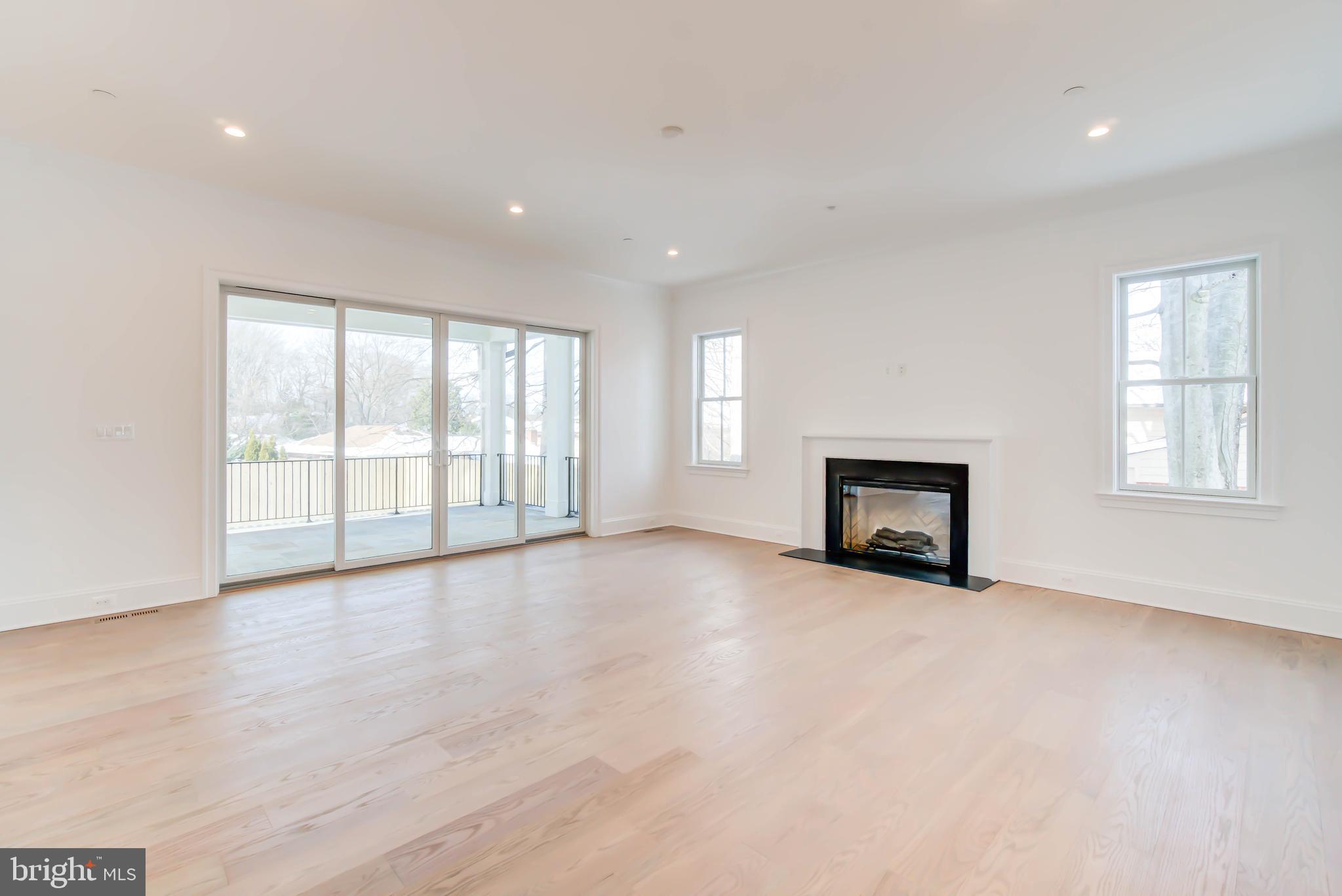 7408 Pyle Road Bethesda, MD 20817 - Photo 28 of 81 a view of an empty room with a window and fireplace
